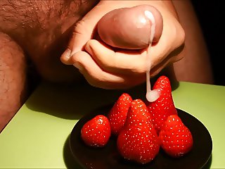 Putting cream on strawberries cumshot